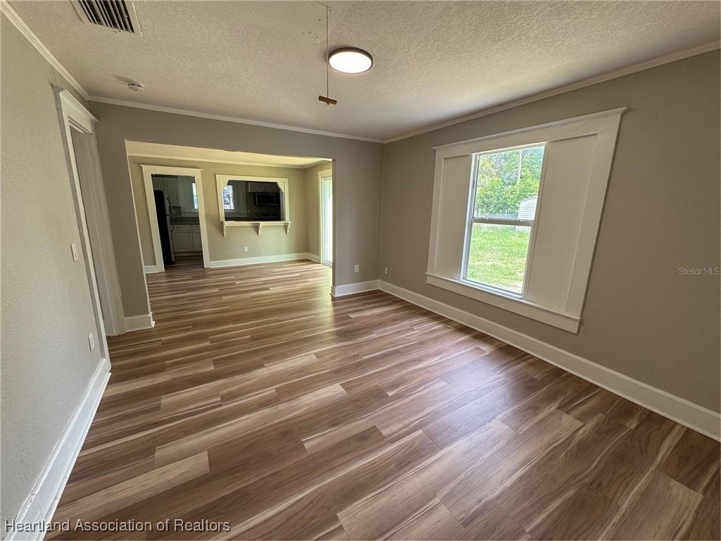 111 D Street Frostproof, FL 33843 - Photo 13 of 40 a view of a room with wooden floor and window