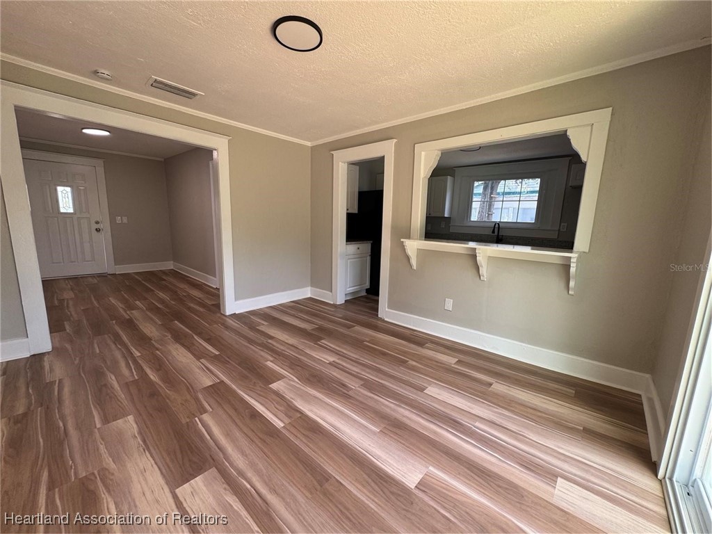 111 D Street Frostproof, FL 33843 - Photo 15 of 40 a view of a hallway with wooden floor and staircase