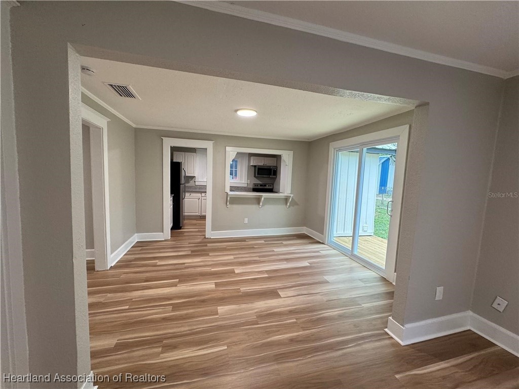 111 D Street Frostproof, FL 33843 - Photo 26 of 40 a view of a room with wooden floor and a window