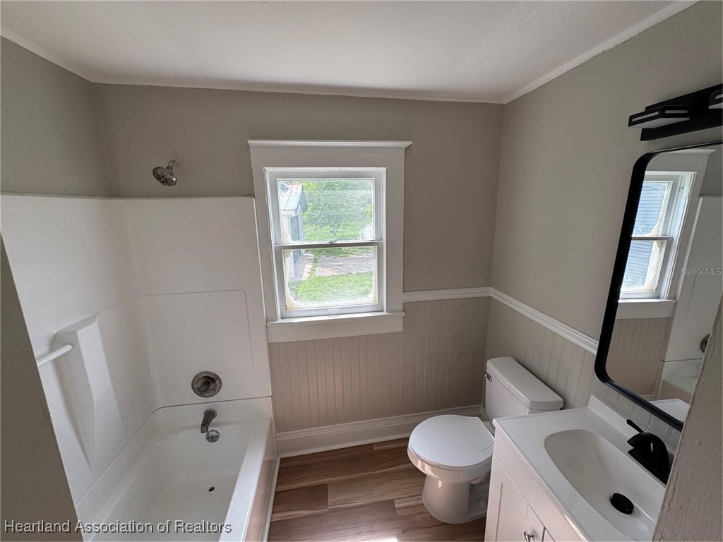 111 D Street Frostproof, FL 33843 - Photo 29 of 40 a bathroom with a sink toilet and shower