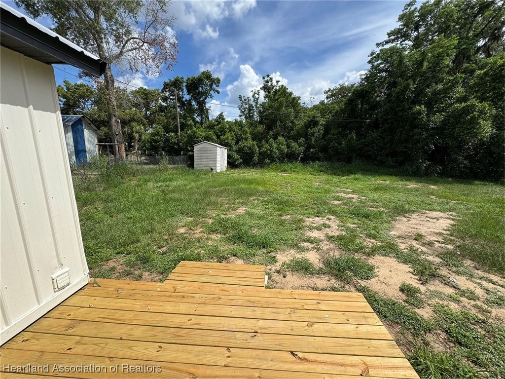 111 D Street Frostproof, FL 33843 - Photo 30 of 40 a backyard of a house with lots of green space