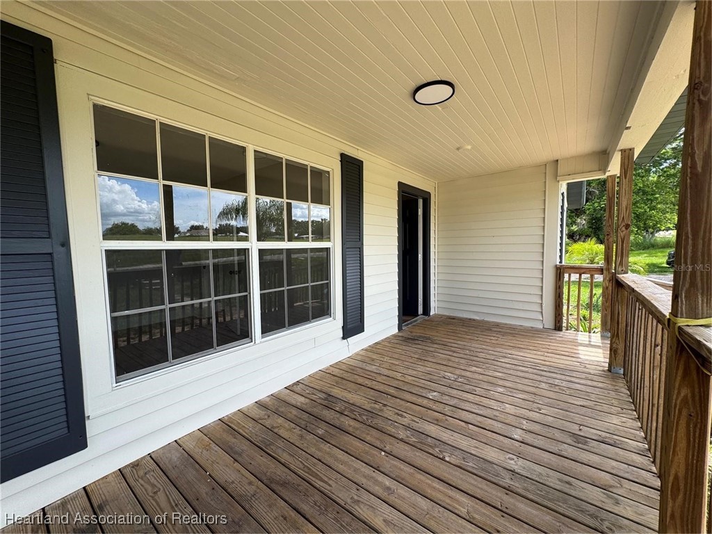 111 D Street Frostproof, FL 33843 - Photo 3 of 40 a view of a balcony with a ceiling fan