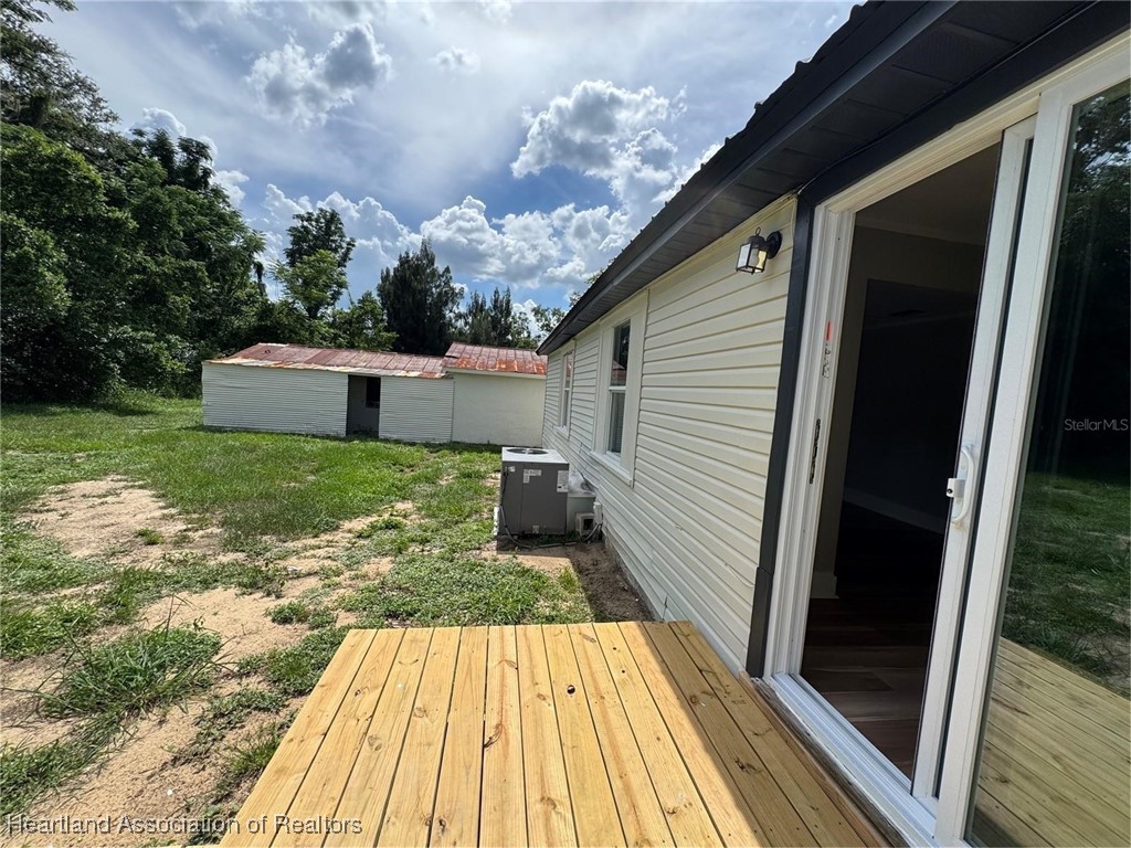 111 D Street Frostproof, FL 33843 - Photo 31 of 40 a view of a backyard with wooden floor