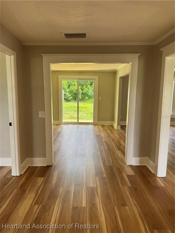 111 D Street Frostproof, FL 33843 - Photo 6 of 40 a view of an empty room with wooden floor and a window