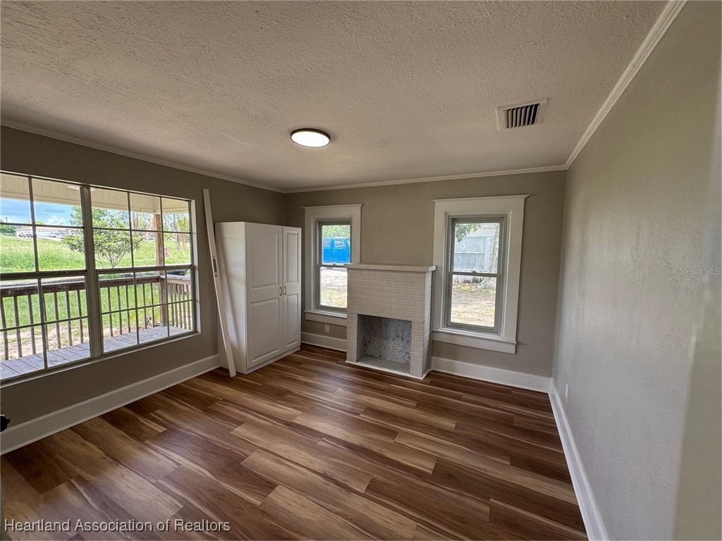 111 D Street Frostproof, FL 33843 - Photo 7 of 40 a view of empty room with wooden floor and fan