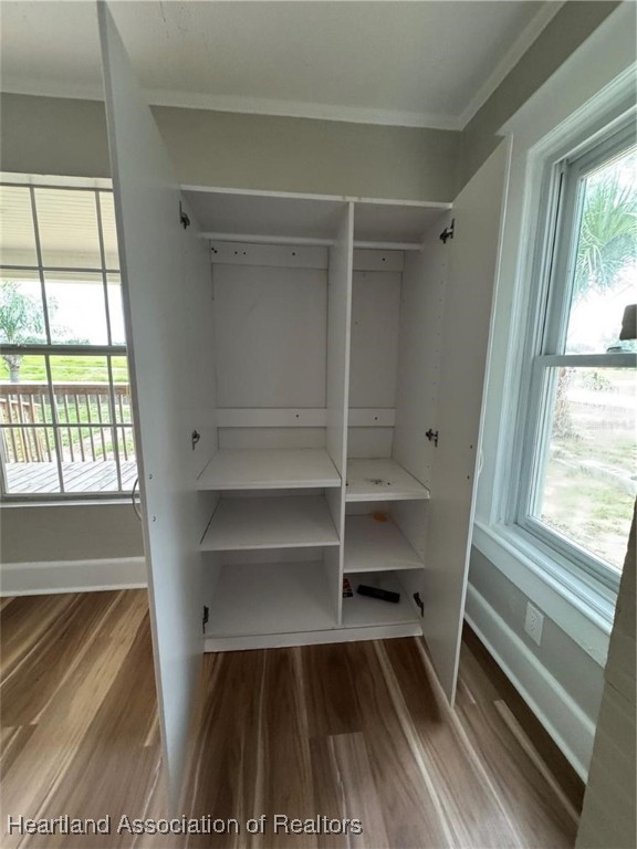 111 D Street Frostproof, FL 33843 - Photo 9 of 40 a view of walk in closet with empty racks