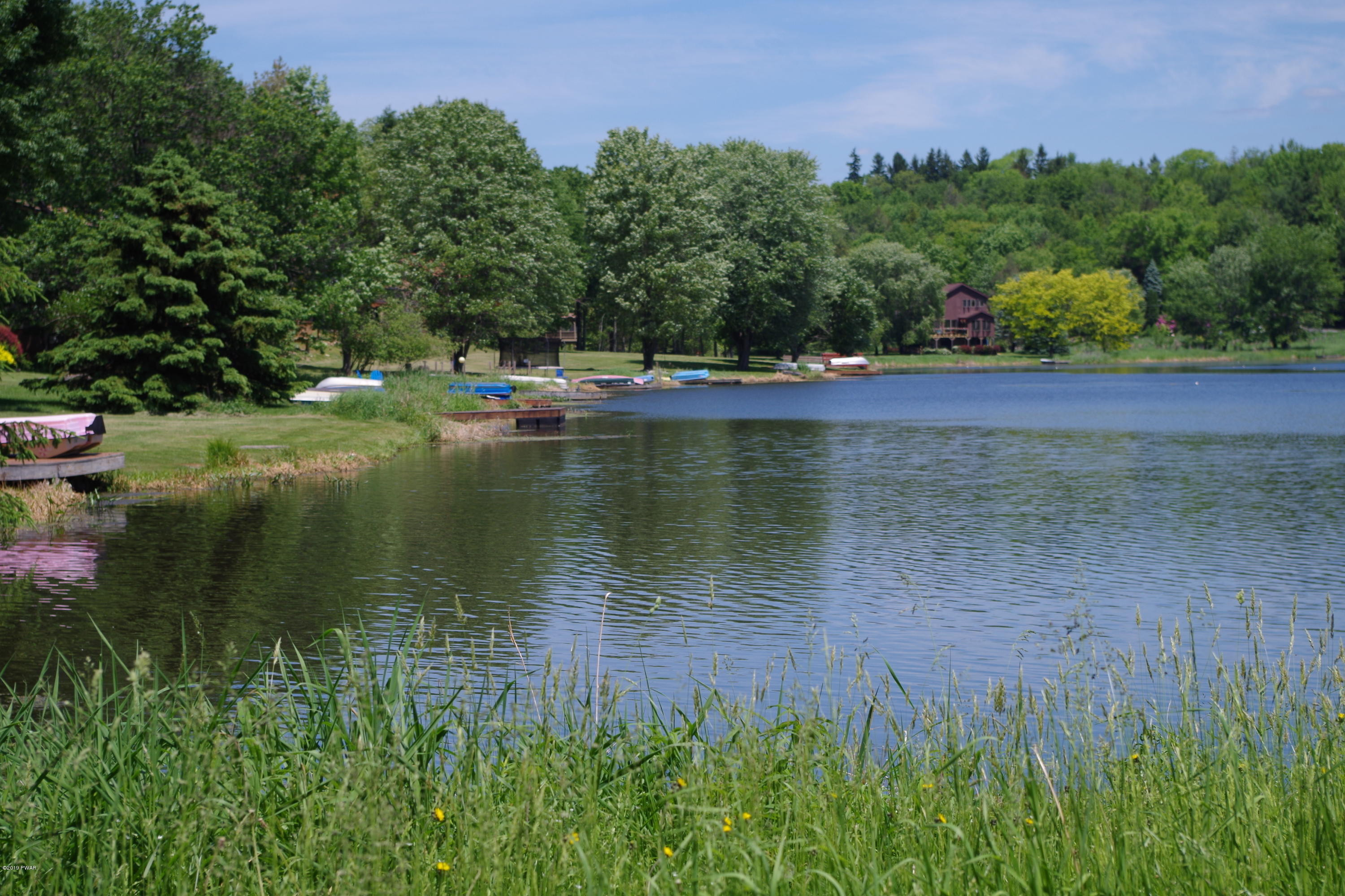 1271 Brookfield Road Lake Ariel, PA 18436 - Photo 89 of 143 a view of a lake with a park