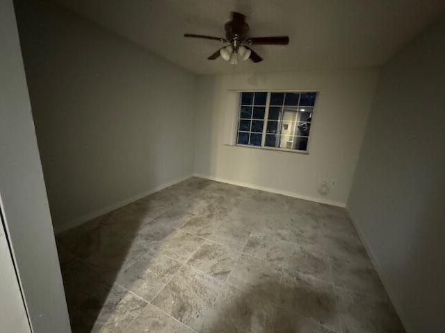 4167 Haverhill Road, Unit 1107 West Palm Beach, FL 33417 - Photo 11 of 13 a view of empty room with windows