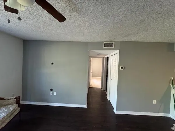 a view of a livingroom with wooden floor