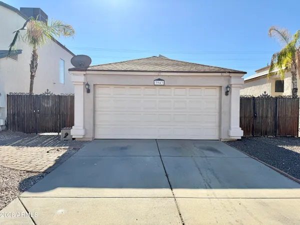 a front view of a house with a garage