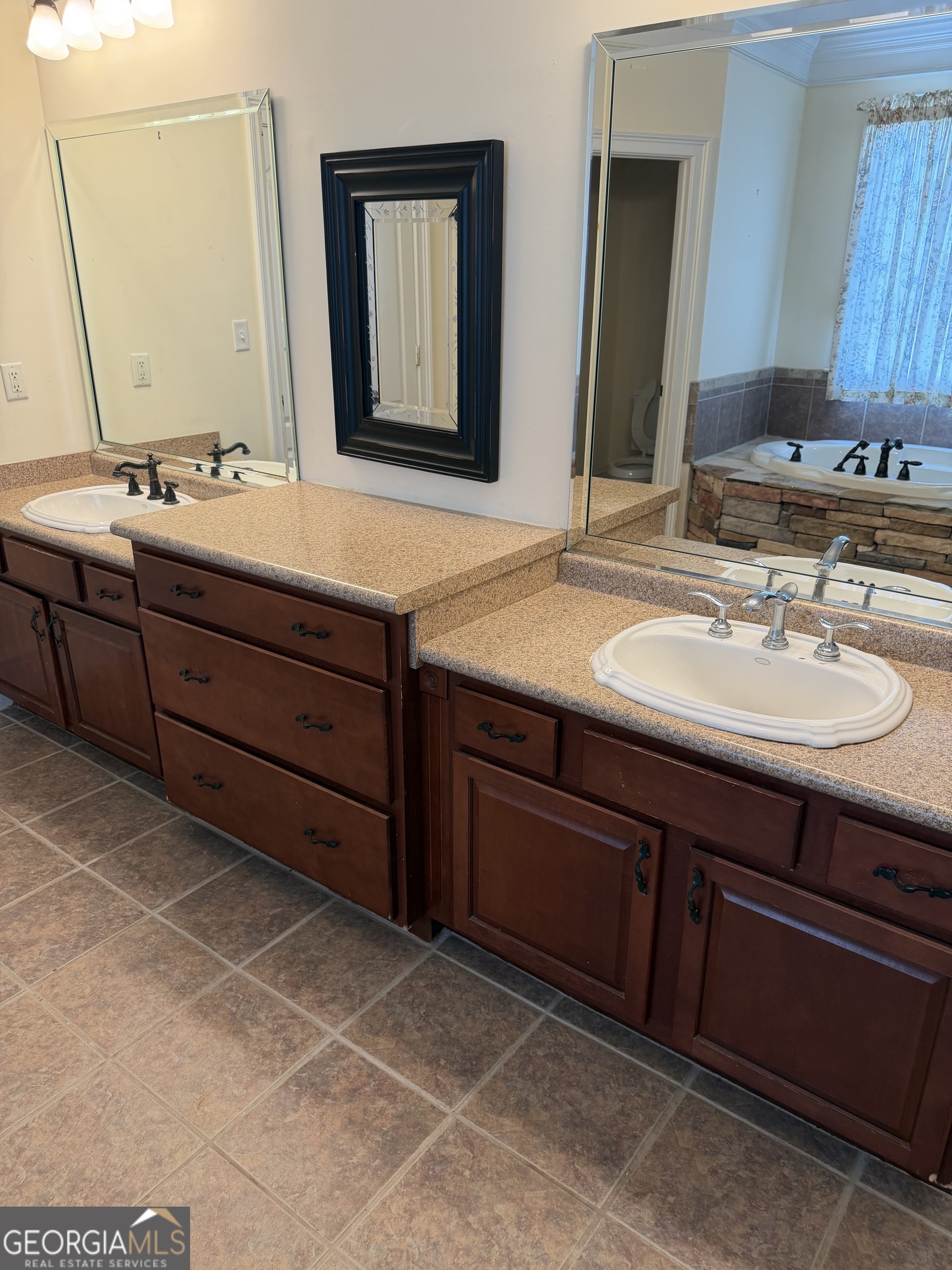 302 Norris Road Barnesville, GA 30204 - Photo 44 of 65 a bathroom with a double vanity sink and a mirror