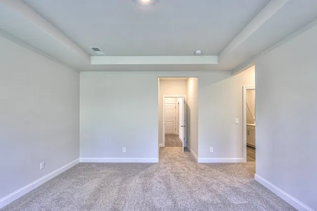 a view of an empty room and a window