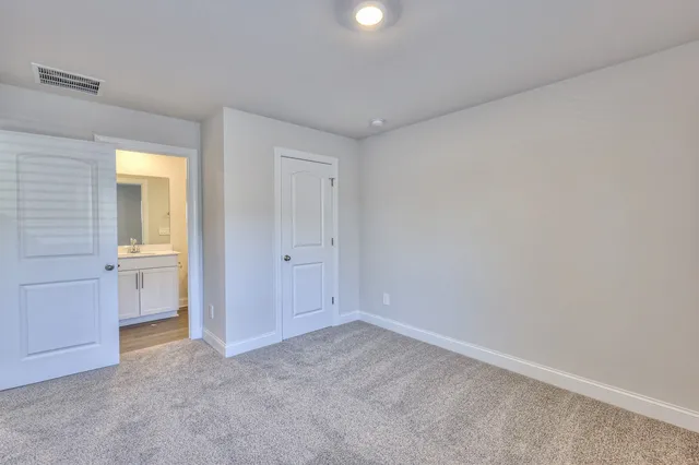 a view of an empty room and a window