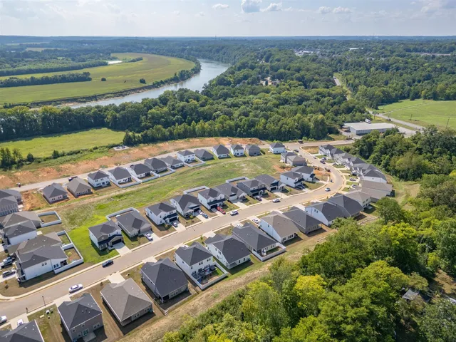 a view of a swimming pool with a yard
