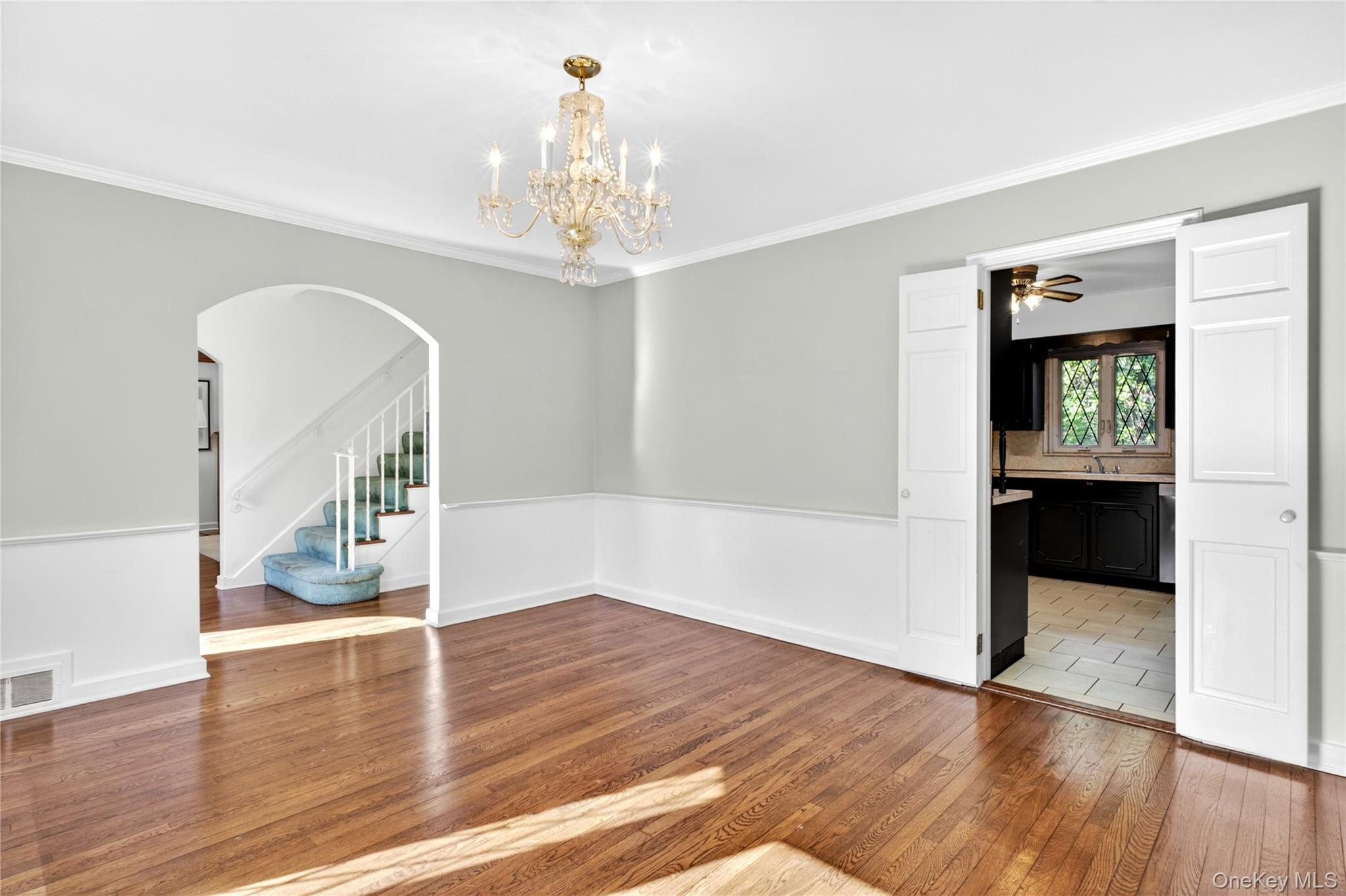 142 Mill Spring Road Manhasset, NY 11030 - Photo 9 of 23 wooden floor in an empty room with a window