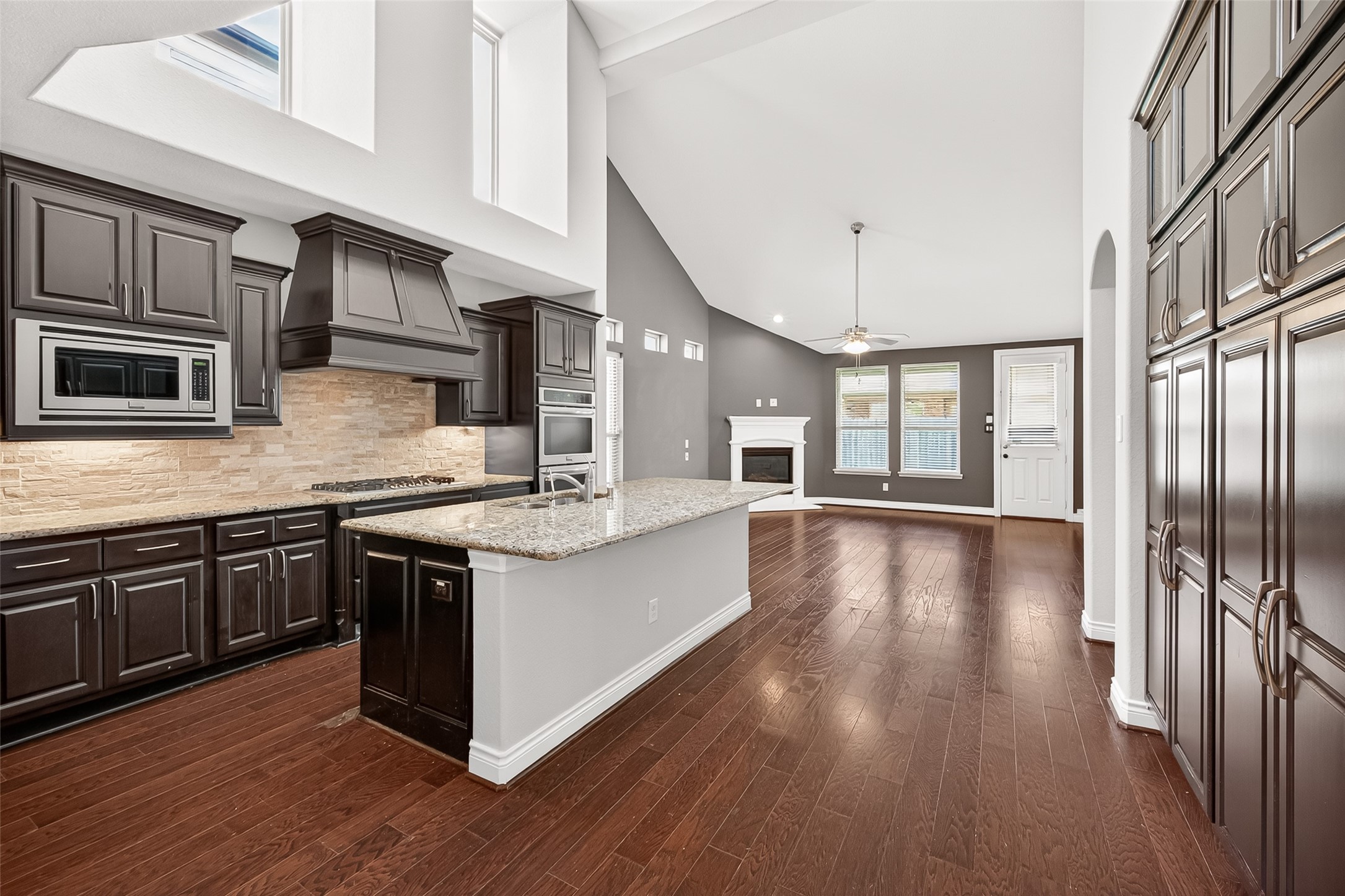 24122 Valencia Ridge Lane Katy, TX 77494 - Photo 12 of 48 a kitchen with stainless steel appliances granite countertop a stove and a sink