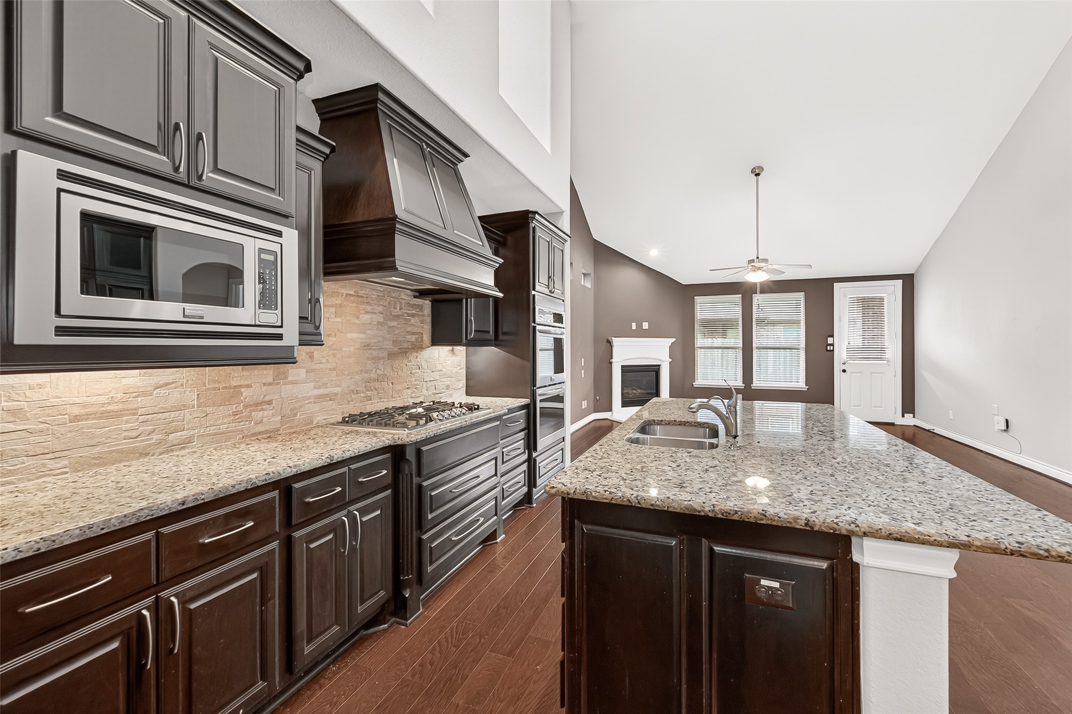 24122 Valencia Ridge Lane Katy, TX 77494 - Photo 17 of 48 a kitchen with stainless steel appliances granite countertop a sink and stove