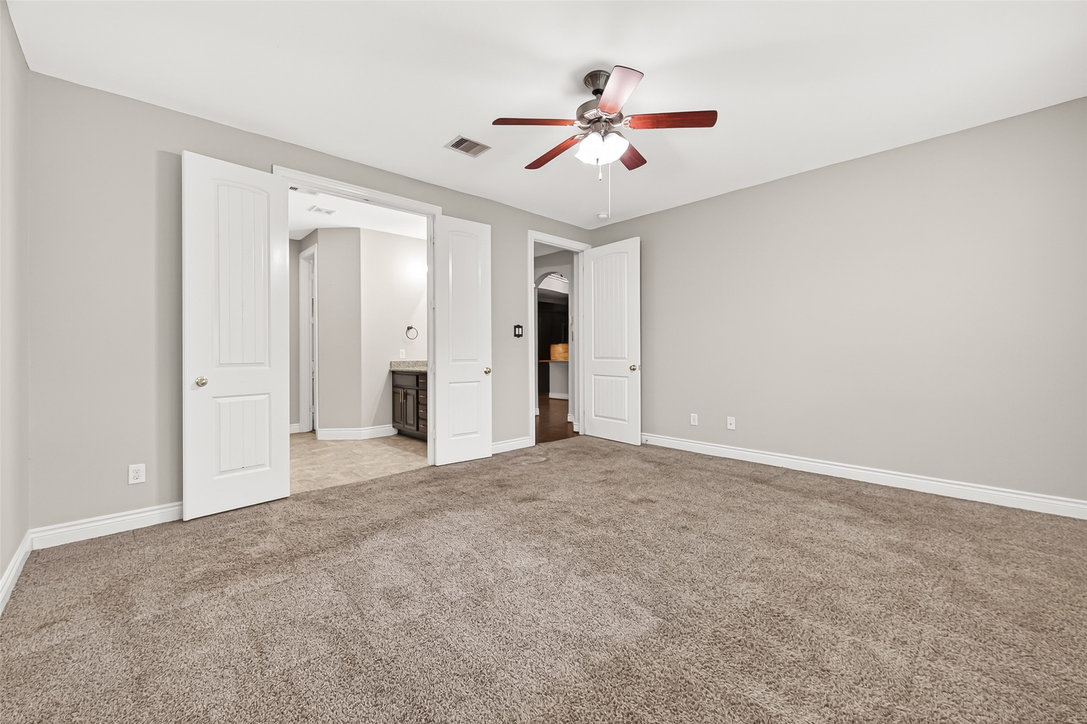 24122 Valencia Ridge Lane Katy, TX 77494 - Photo 21 of 48 a view of an empty room with a chandelier fan