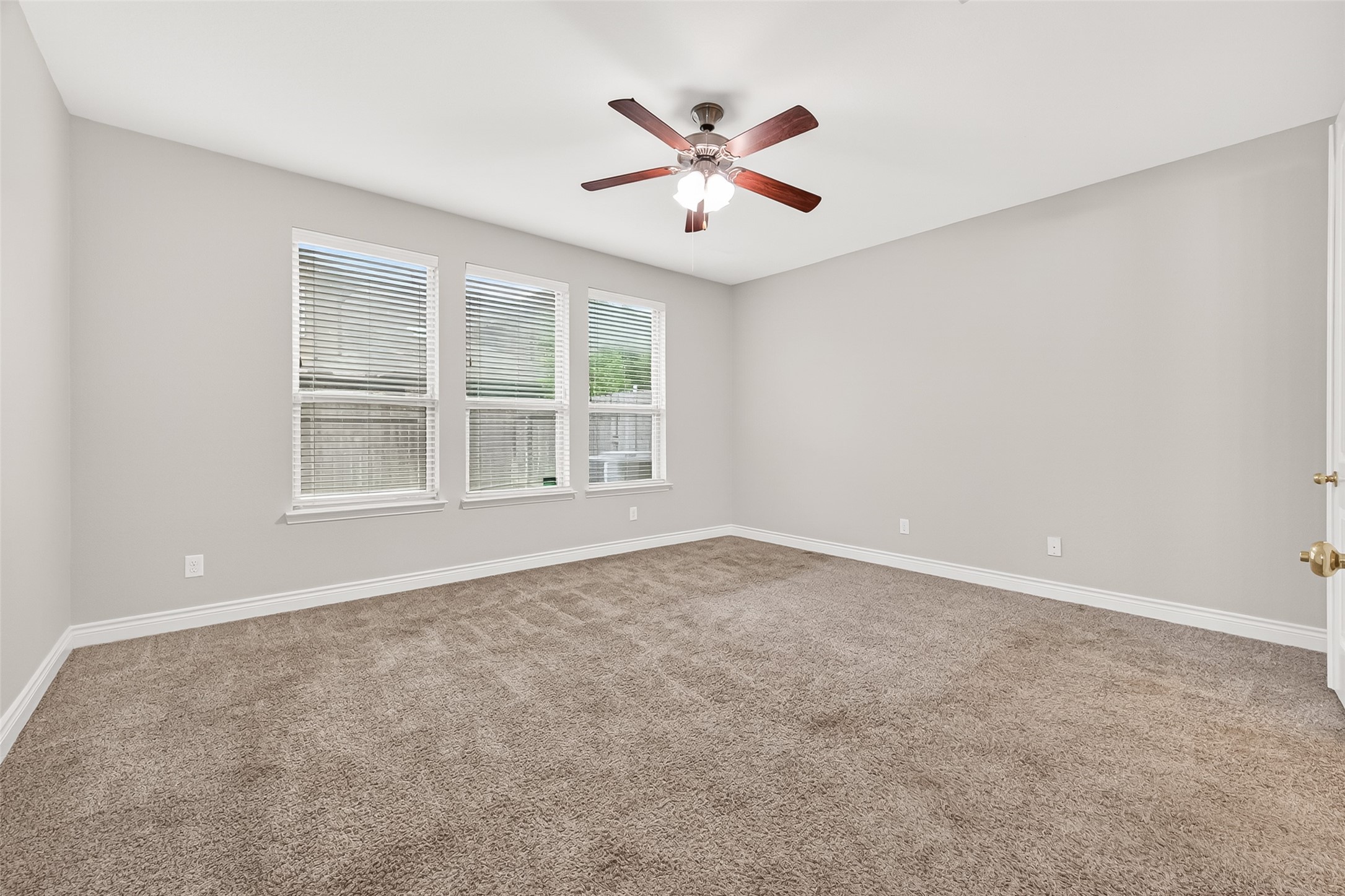 24122 Valencia Ridge Lane Katy, TX 77494 - Photo 22 of 48 an empty room with window and ceiling fan