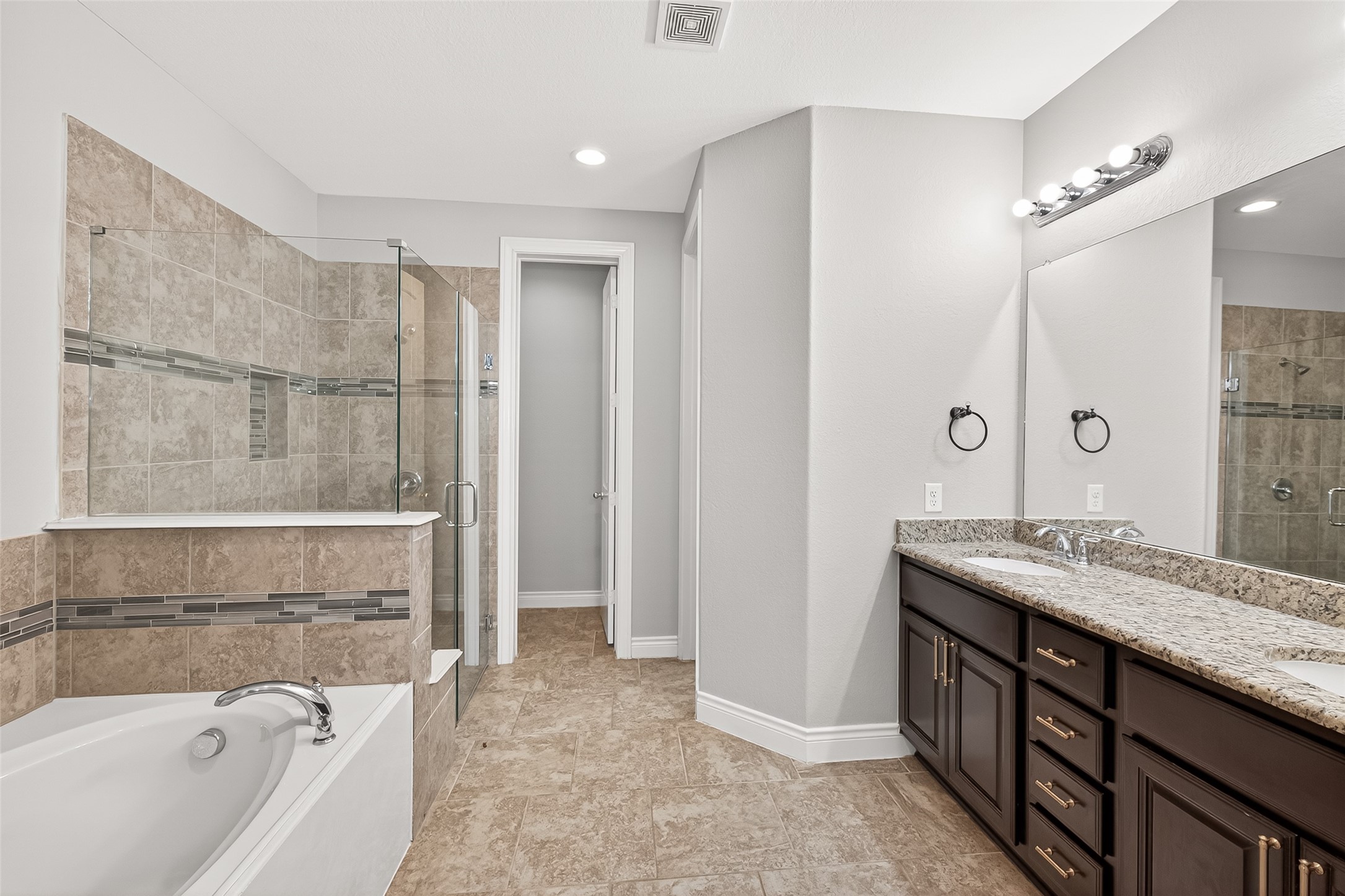 24122 Valencia Ridge Lane Katy, TX 77494 - Photo 23 of 48 View of the Primary Bathroom featuring double sinks, large shower and tub.