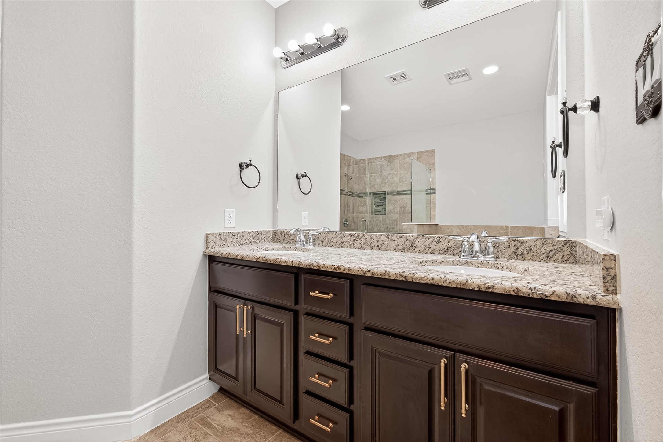 24122 Valencia Ridge Lane Katy, TX 77494 - Photo 24 of 48 a bathroom with a granite countertop sink and a mirror