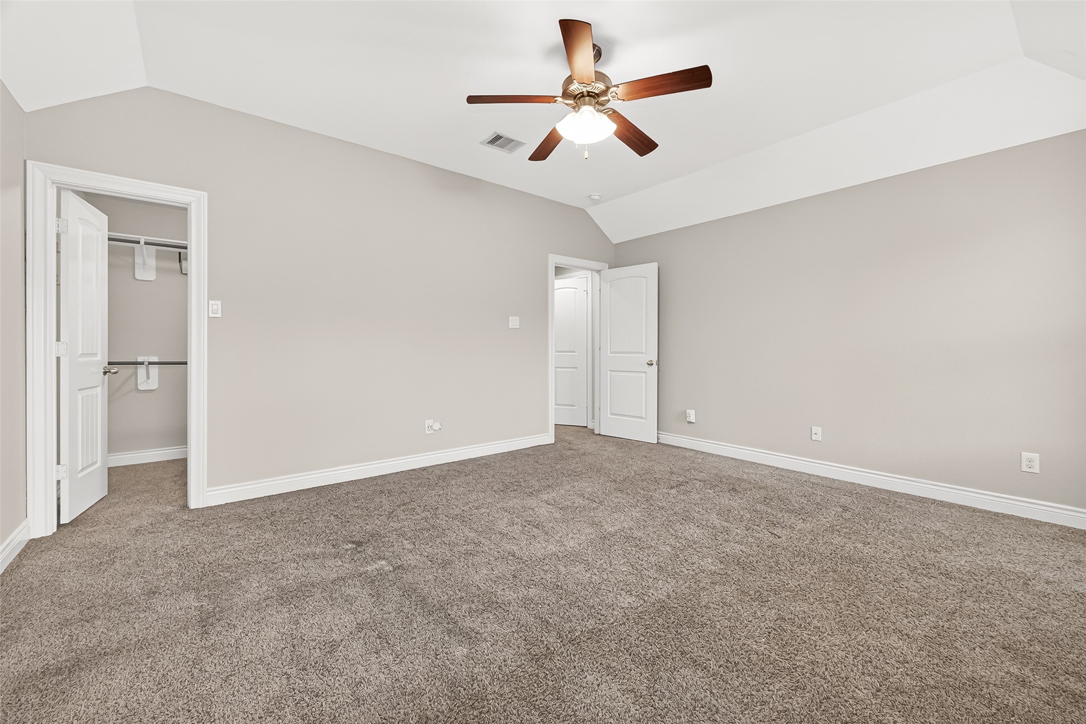 24122 Valencia Ridge Lane Katy, TX 77494 - Photo 40 of 48 an empty room with closet and a ceiling fan