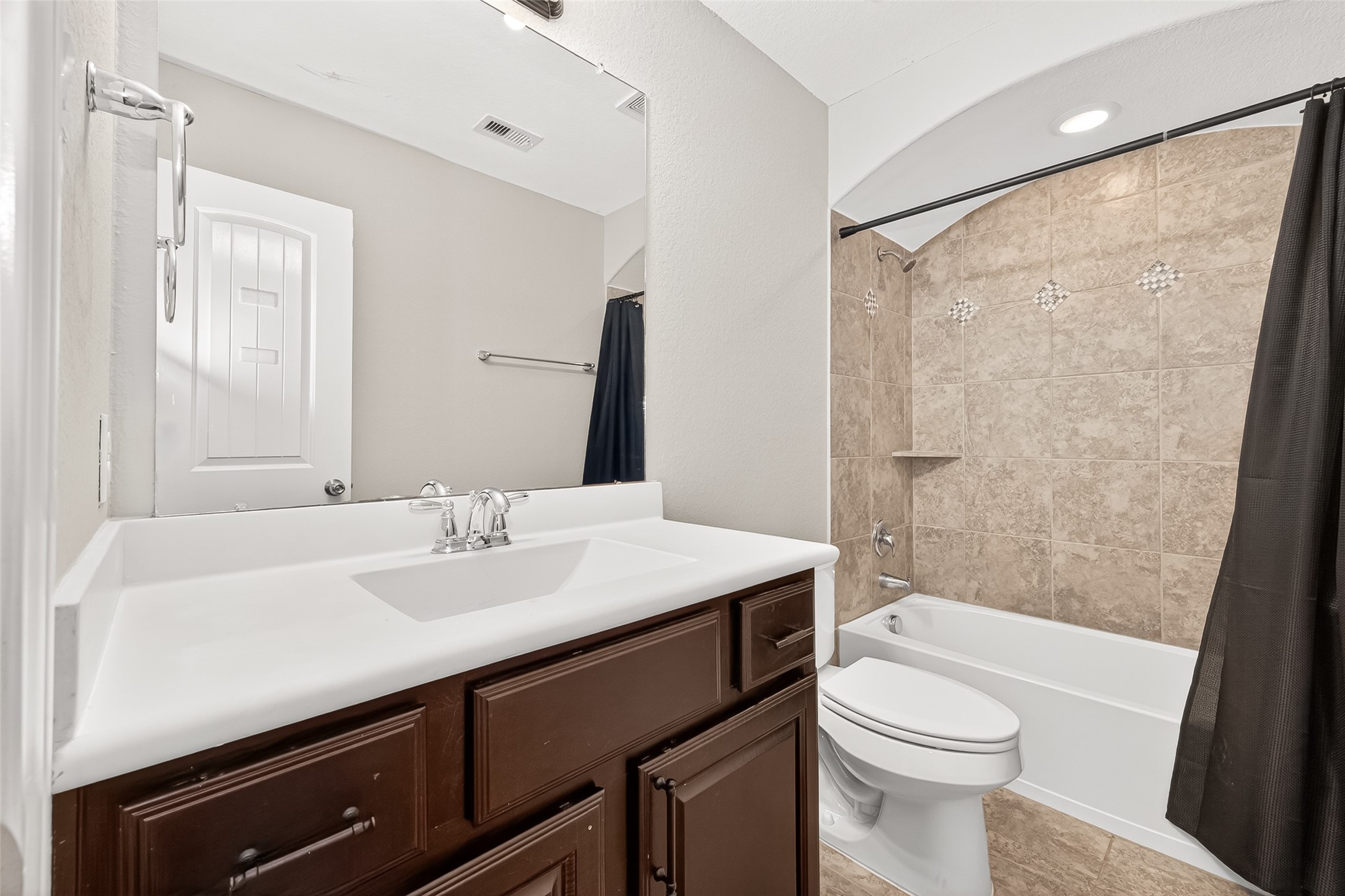 24122 Valencia Ridge Lane Katy, TX 77494 - Photo 41 of 48 a bathroom with a sink a toilet a mirror and shower