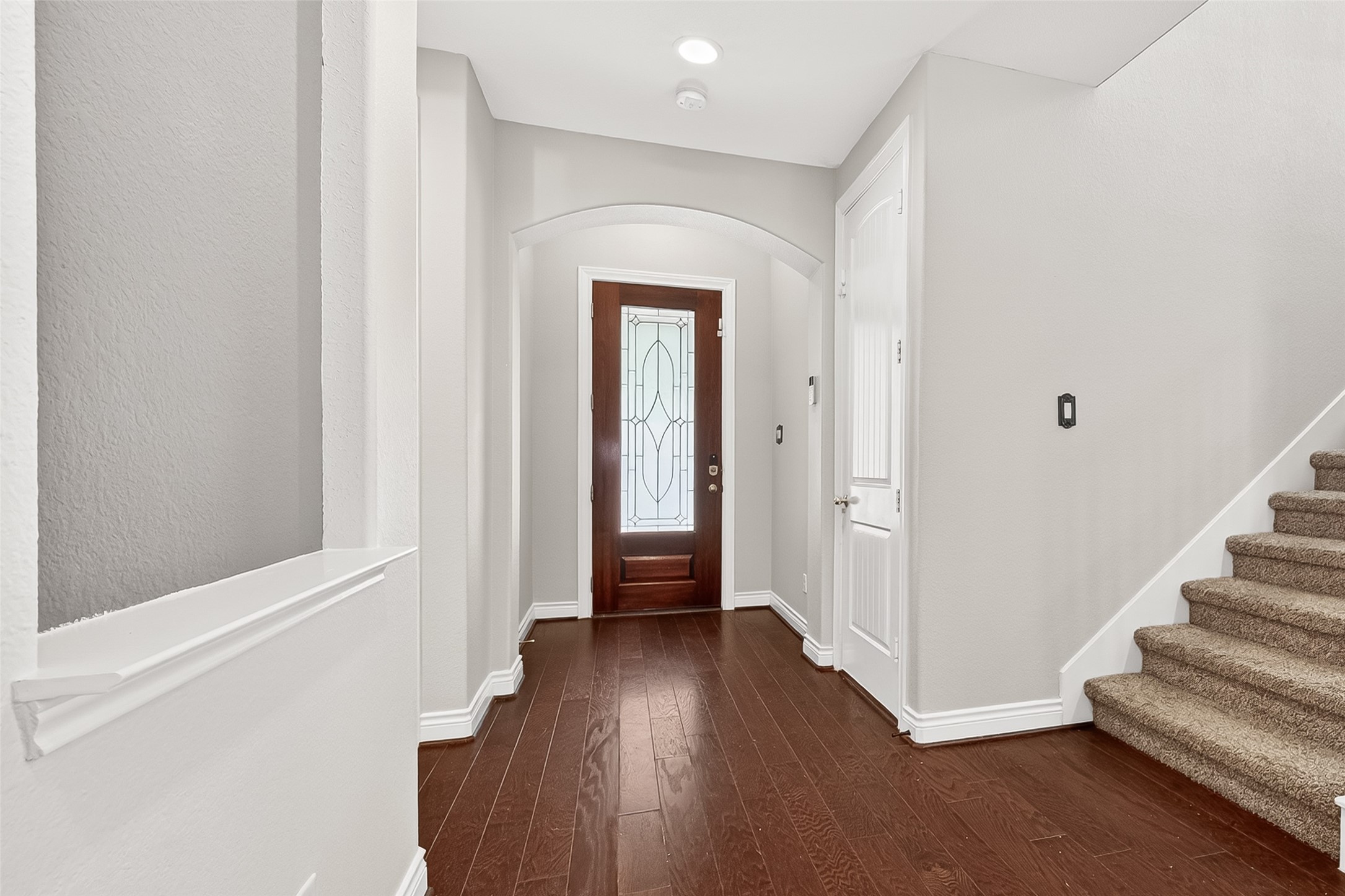 24122 Valencia Ridge Lane Katy, TX 77494 - Photo 5 of 48 a view of a hallway with wooden floor and entryway