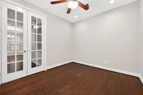 a kitchen with stainless steel appliances granite countertop a kitchen island wooden floors and granite counter tops