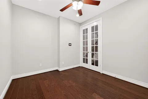 a kitchen with granite countertop a stove top oven cabinetry and granite counter tops