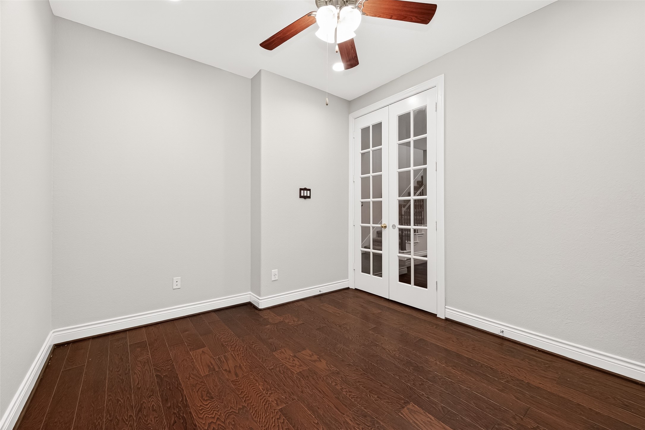 24122 Valencia Ridge Lane Katy, TX 77494 - Photo 8 of 48 an empty room with wooden floor and windows