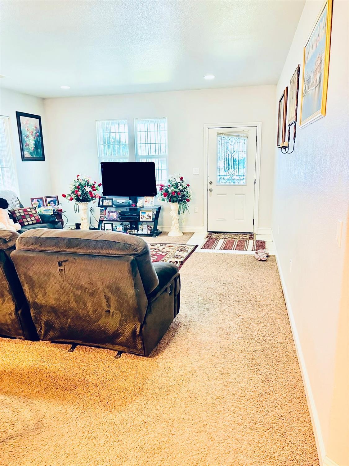 3416 Rio Linda Boulevard Sacramento, CA 95838 - Photo 5 of 13 a living room with a couch and a flat screen tv