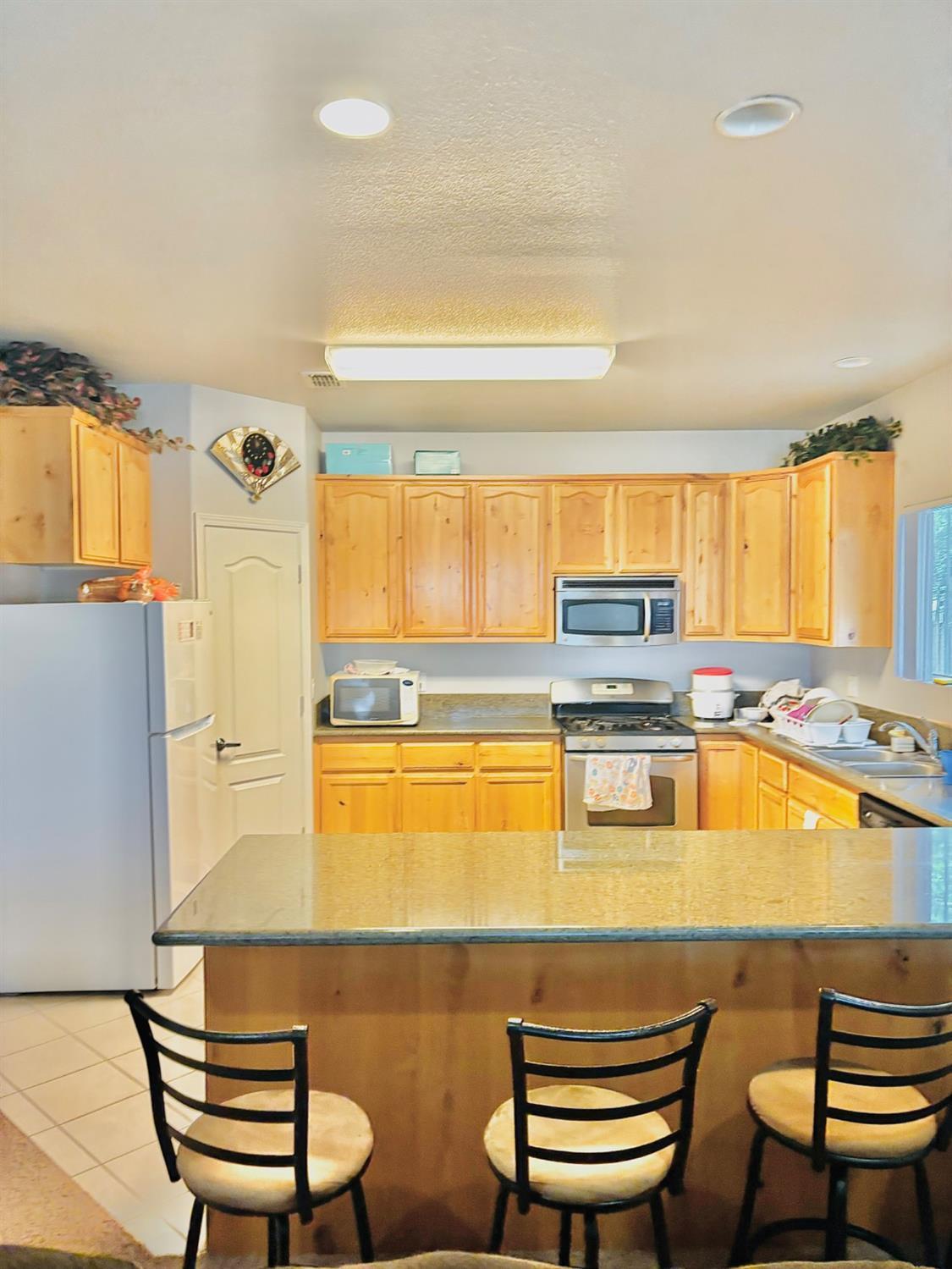 3416 Rio Linda Boulevard Sacramento, CA 95838 - Photo 6 of 13 a kitchen with a sink and a stove top oven