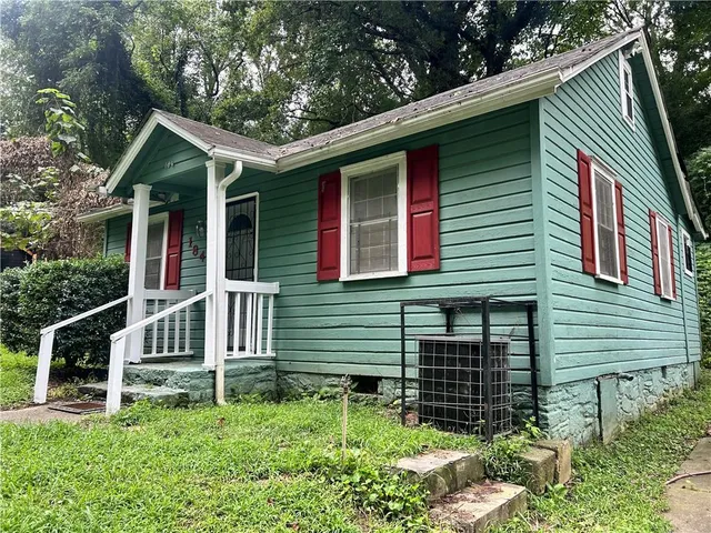 a kitchen with kitchen island a counter space a sink a stove and refrigerator