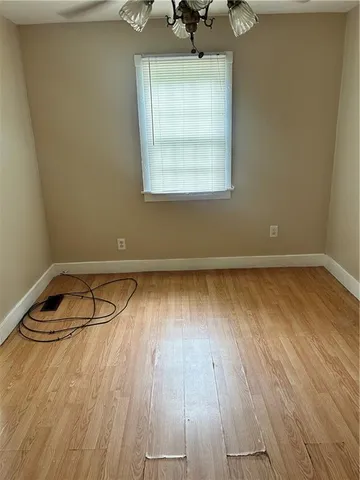 a bathroom with a toilet sink vanity and shower