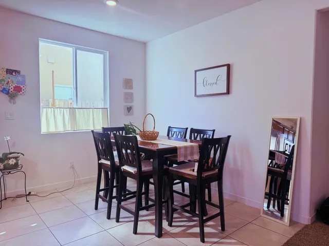 a view of a dining room with furniture