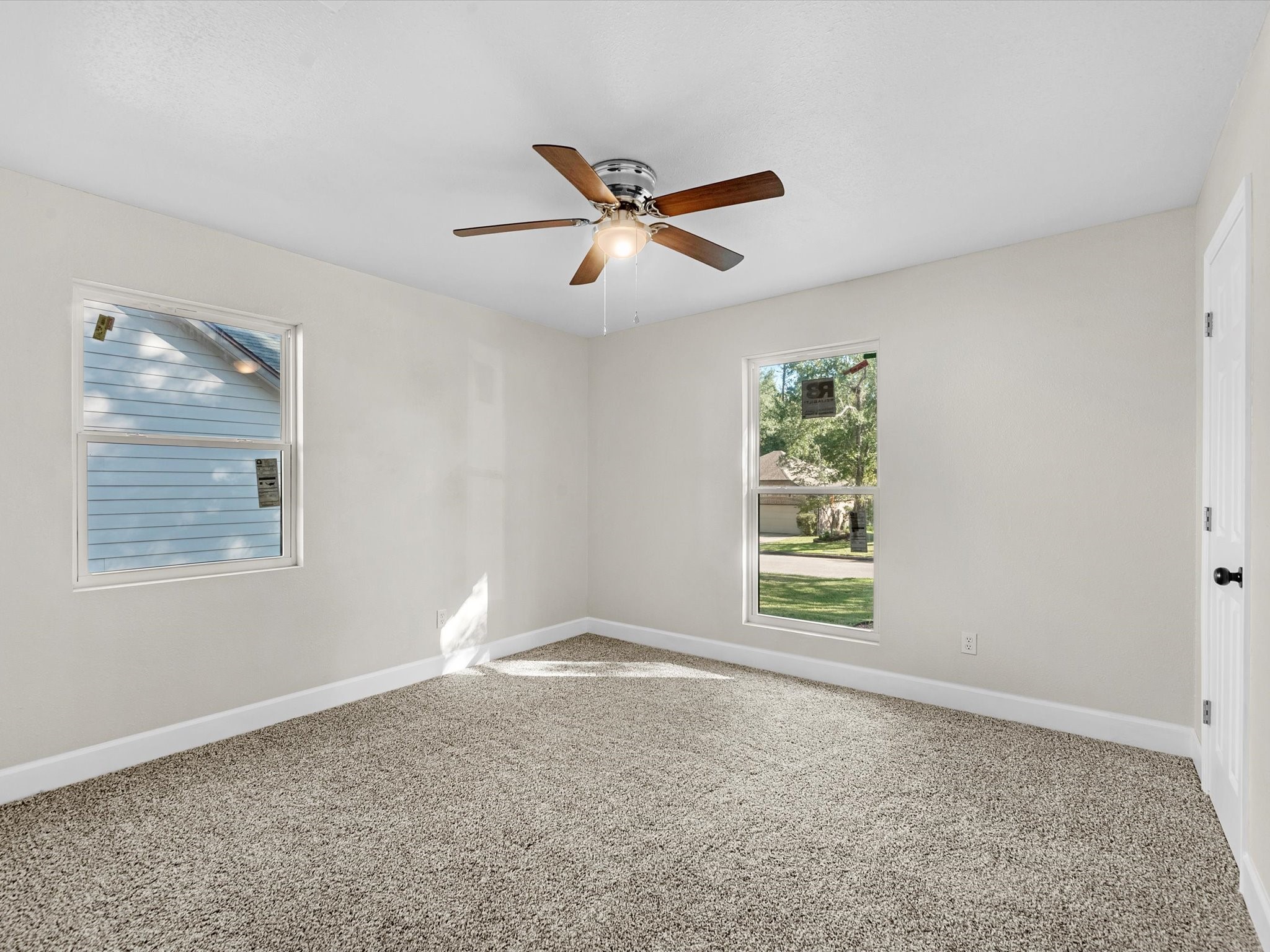 9096 North Comanche Circle Willis, TX 77378 - Photo 21 of 30 Front facing bedroom showing the wonderful oak trees