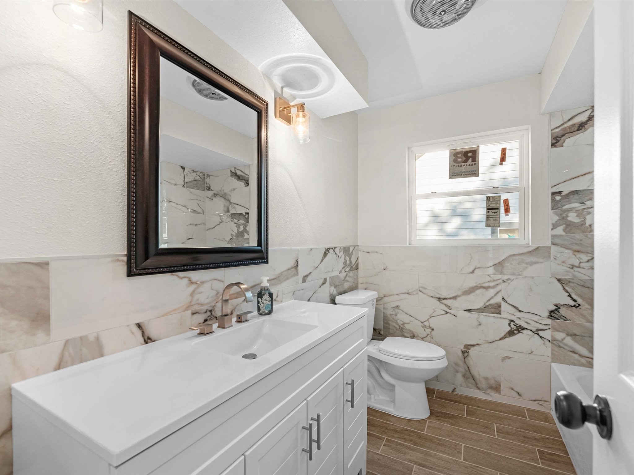 9096 North Comanche Circle Willis, TX 77378 - Photo 22 of 30 Secondary bathroom filled with gorgeous marble tile
