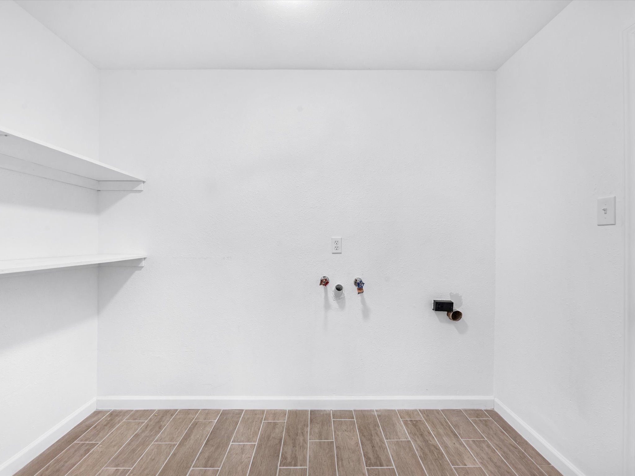 9096 North Comanche Circle Willis, TX 77378 - Photo 24 of 30 Large laundry area with extra shelving for storage