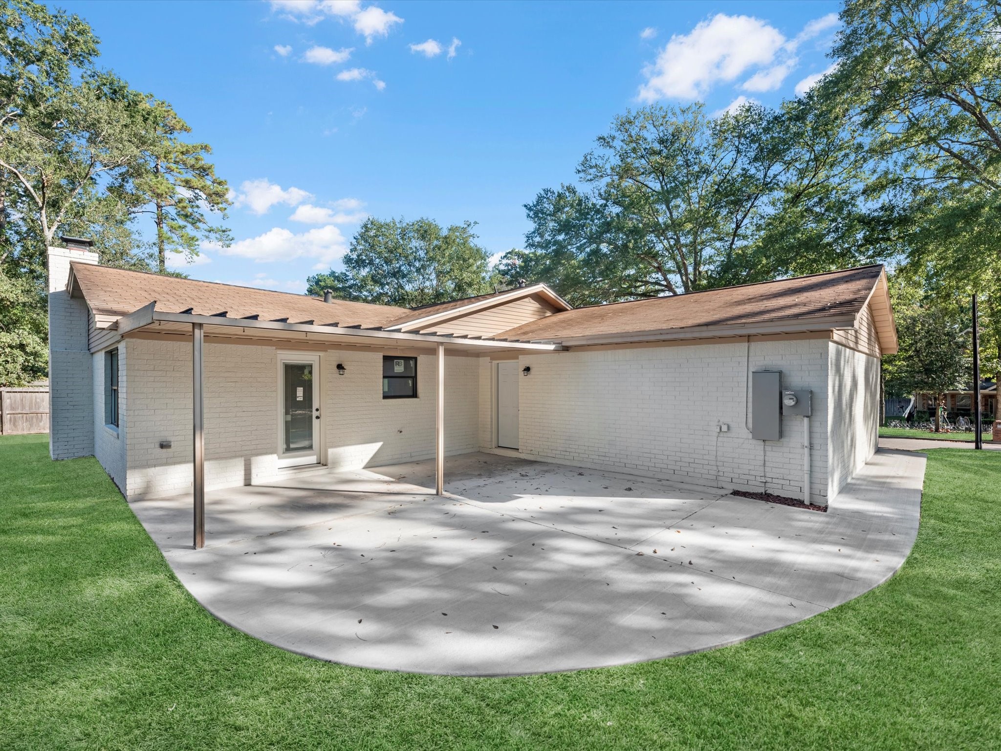 9096 North Comanche Circle Willis, TX 77378 - Photo 25 of 30 Covered patio, all new concrete for patio and walkway to the front of the home, New Electrical Panel