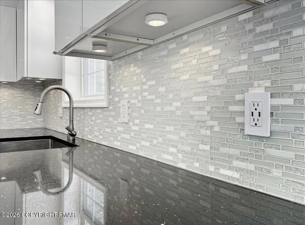 a bathroom with a tub and sink