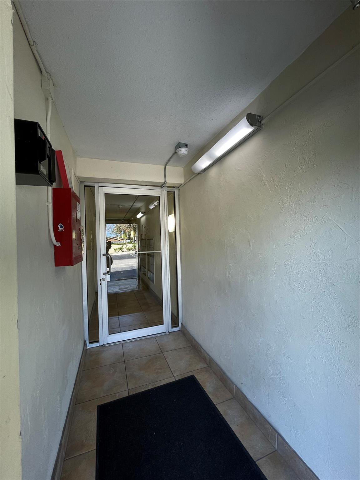 257 South Cypress Road, Unit 414 Pompano Beach, FL 33060 - Photo 53 of 60 SECURED BLDG/ ENTRY
