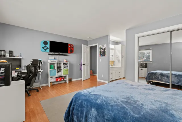 a bedroom with a bed and a tv on the table