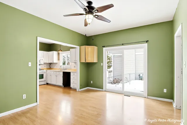 a view of a kitchen with a sink and a window