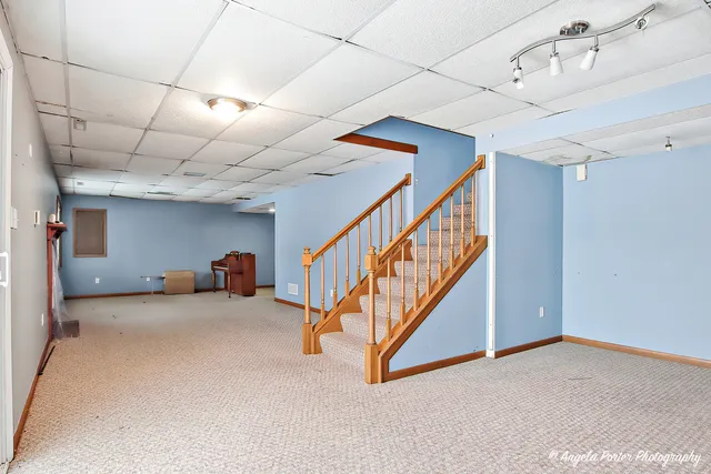 a view of an empty room with stairs