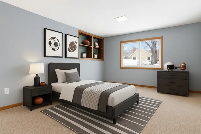 a bedroom with bed and window