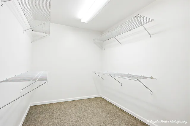 a view of small space with racks on the wall