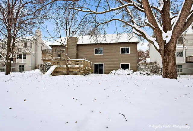 a view of a house with snow on the road