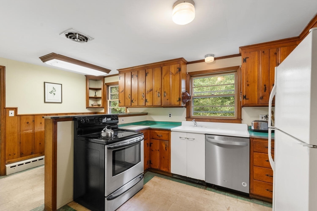 19 Crescent Road Lexington, MA 02421 - Photo 13 of 29 a kitchen with a stove and a sink