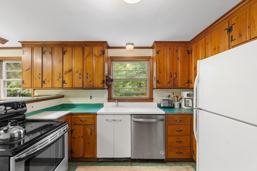 19 Crescent Road Lexington, MA 02421 - Photo 14 of 29 a kitchen with a sink stove and cabinets